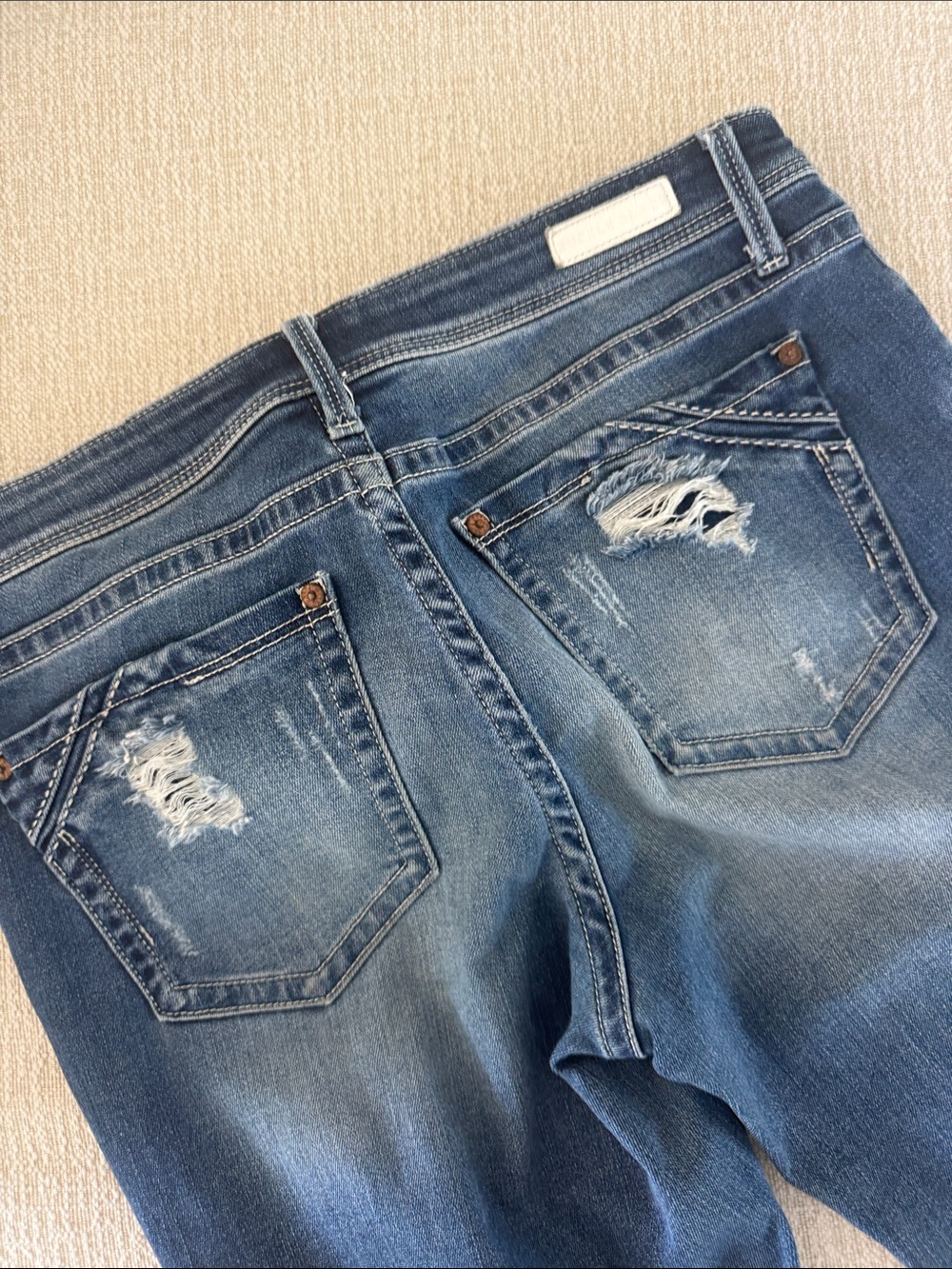 Buckle Skinny Jeans in Medium Blue Wash with Distressed Hem - Picture 3 of 5